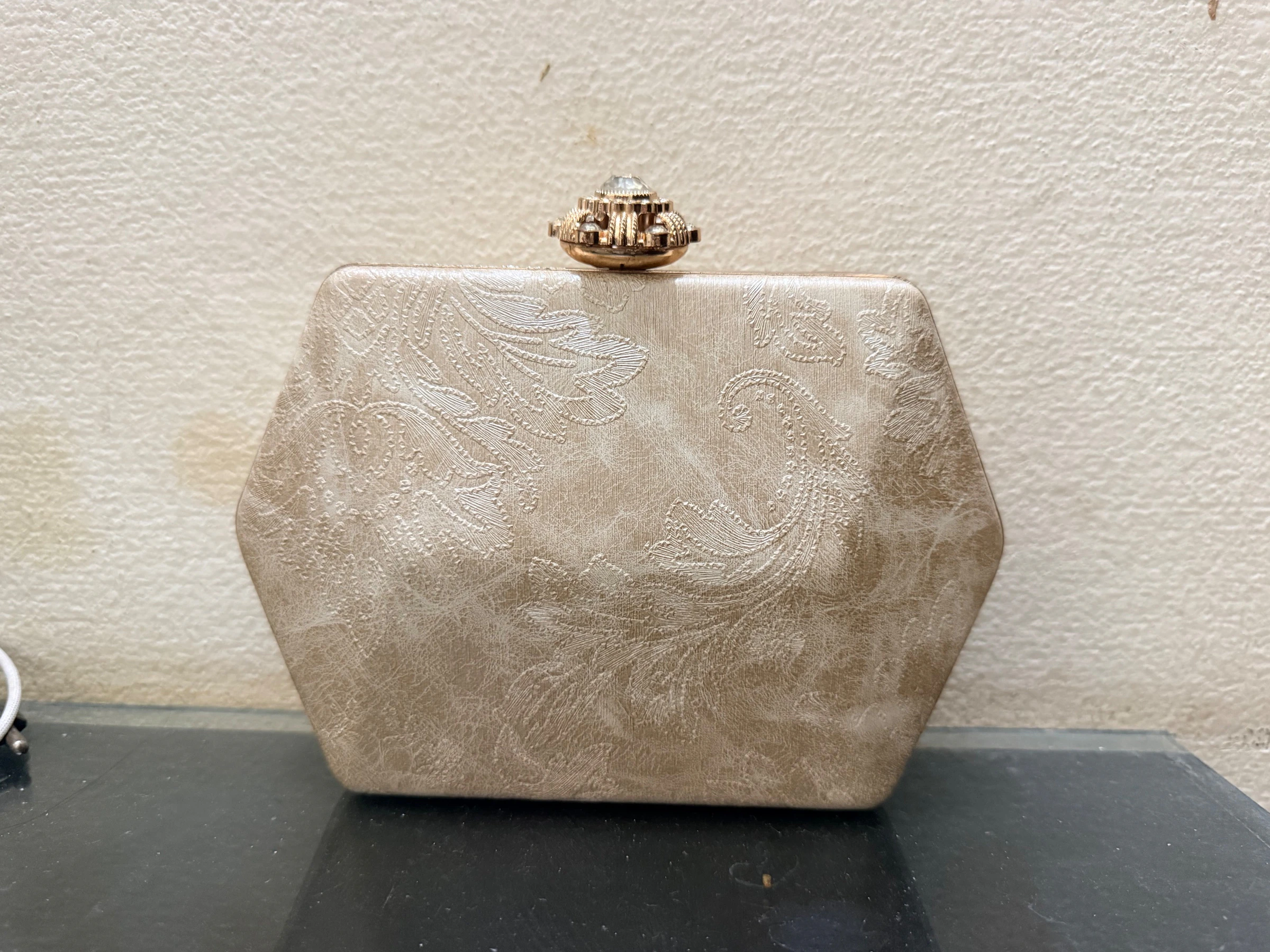 Embossed box clutch